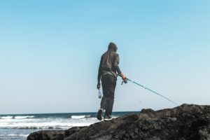 Man fishing on the shore