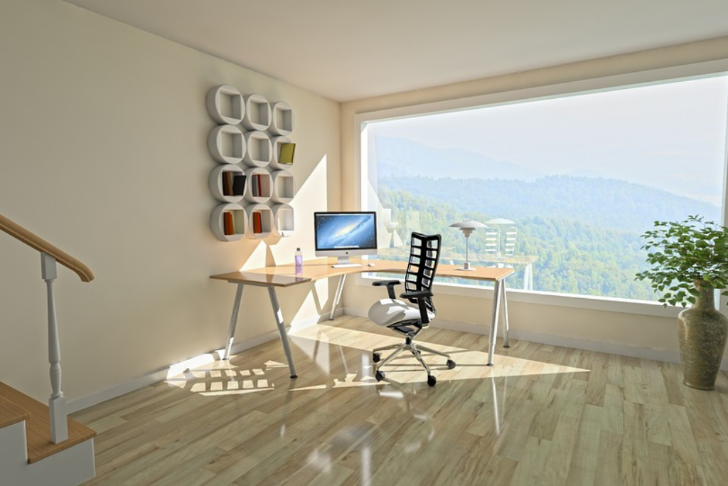office room with laptop, table and chair