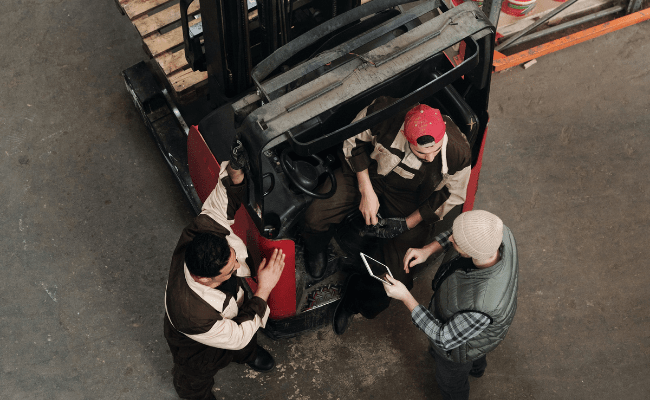 man taking regarding warehouse machinary maintenance