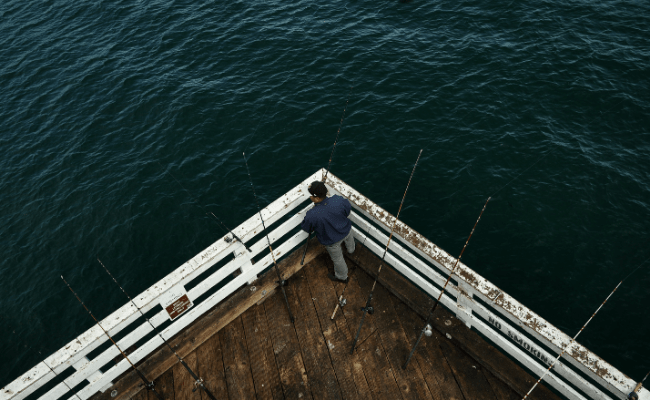 Man fishing on a jetty